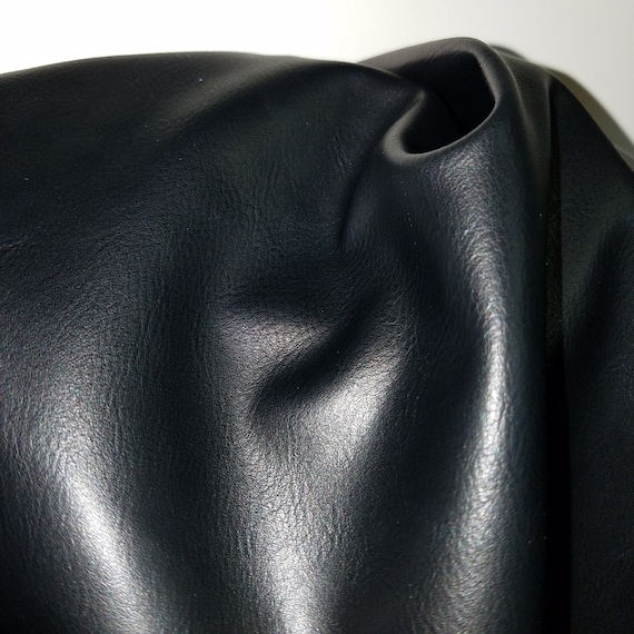 An application scenario or product detail of black fake leather fabric - Image 9