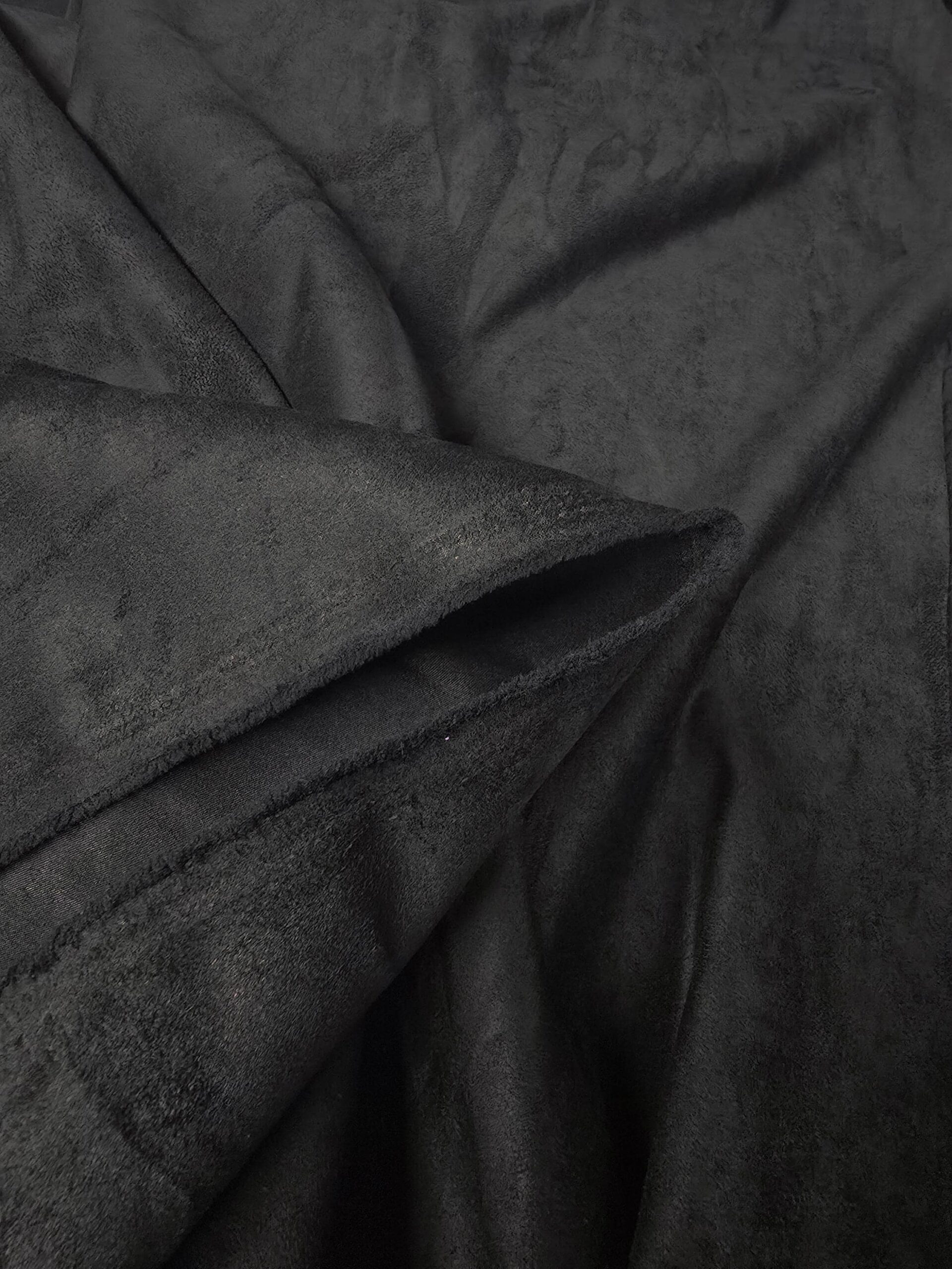 An application scenario or product detail of black faux suede fabric - Image 3