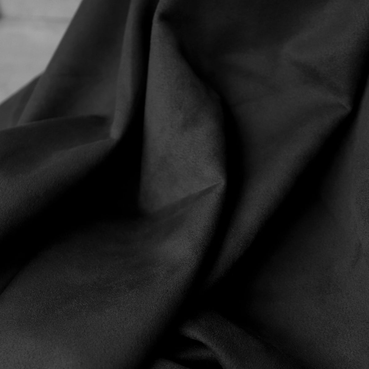 An application scenario or product detail of black faux suede fabric - Image 13