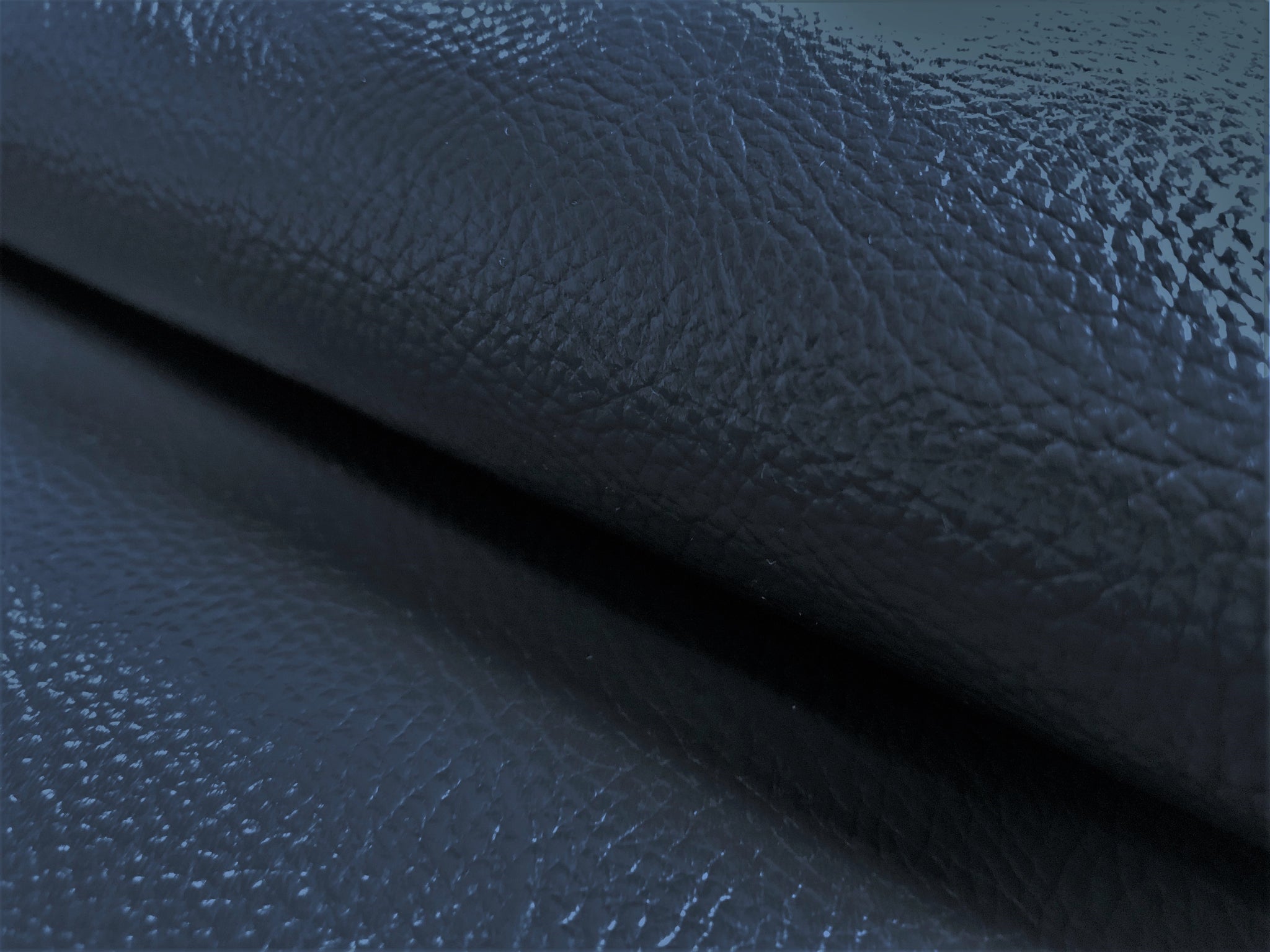 An application scenario or product detail of blue faux leather fabric - Image 13