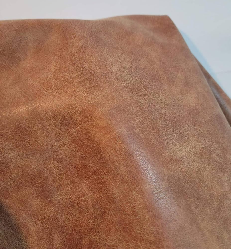 An application scenario or product detail of fake leather fabric by the yard - Image 2