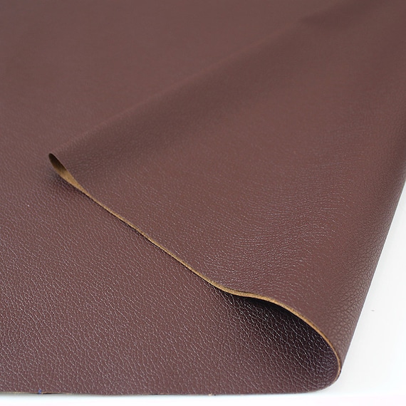 An application scenario or product detail of fake leather fabric by the yard - Image 5