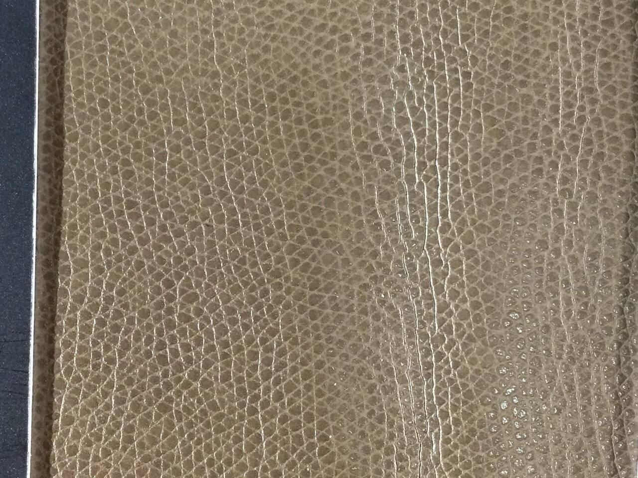 An application scenario or product detail of fake leather fabric by the yard - Image 18