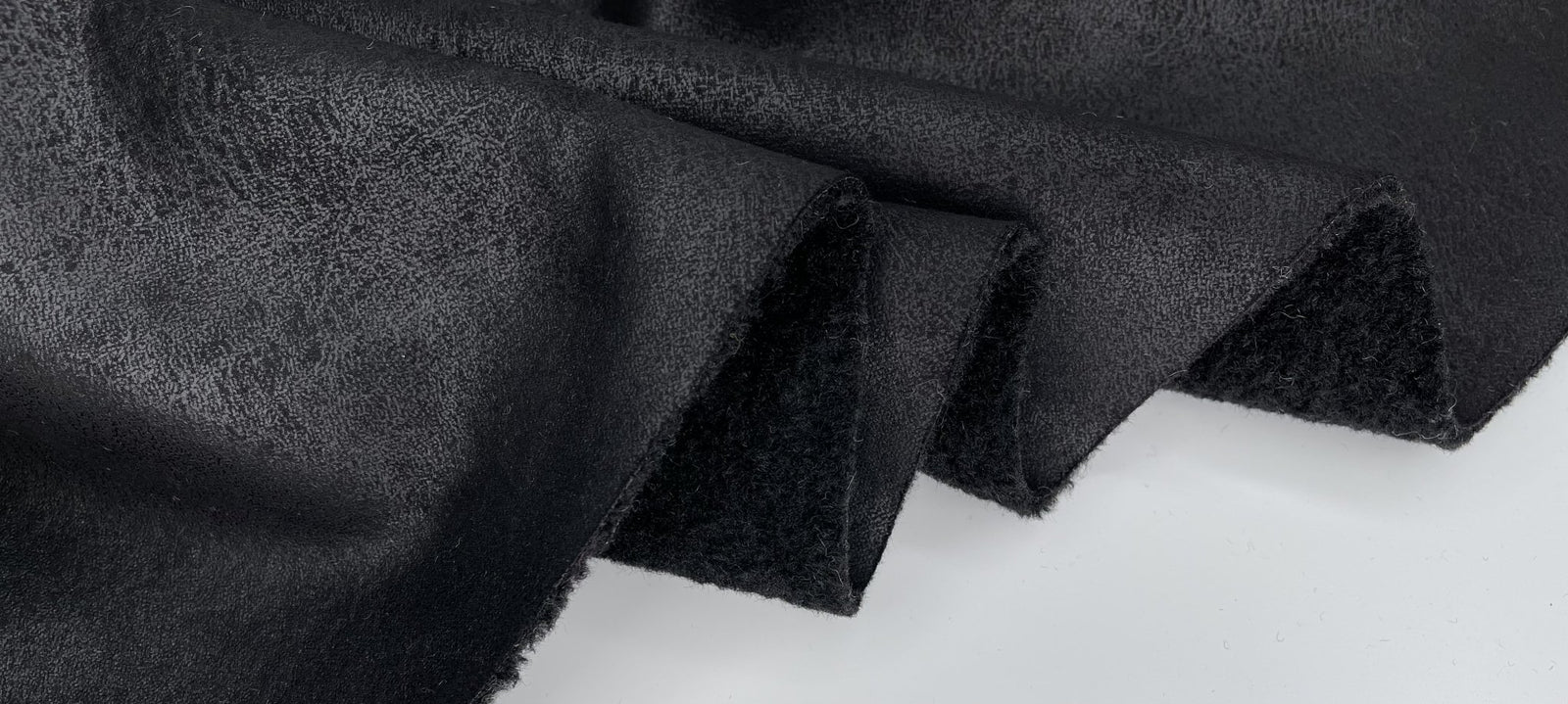 An application scenario or product detail of faux suede fabric for clothing - Image 9