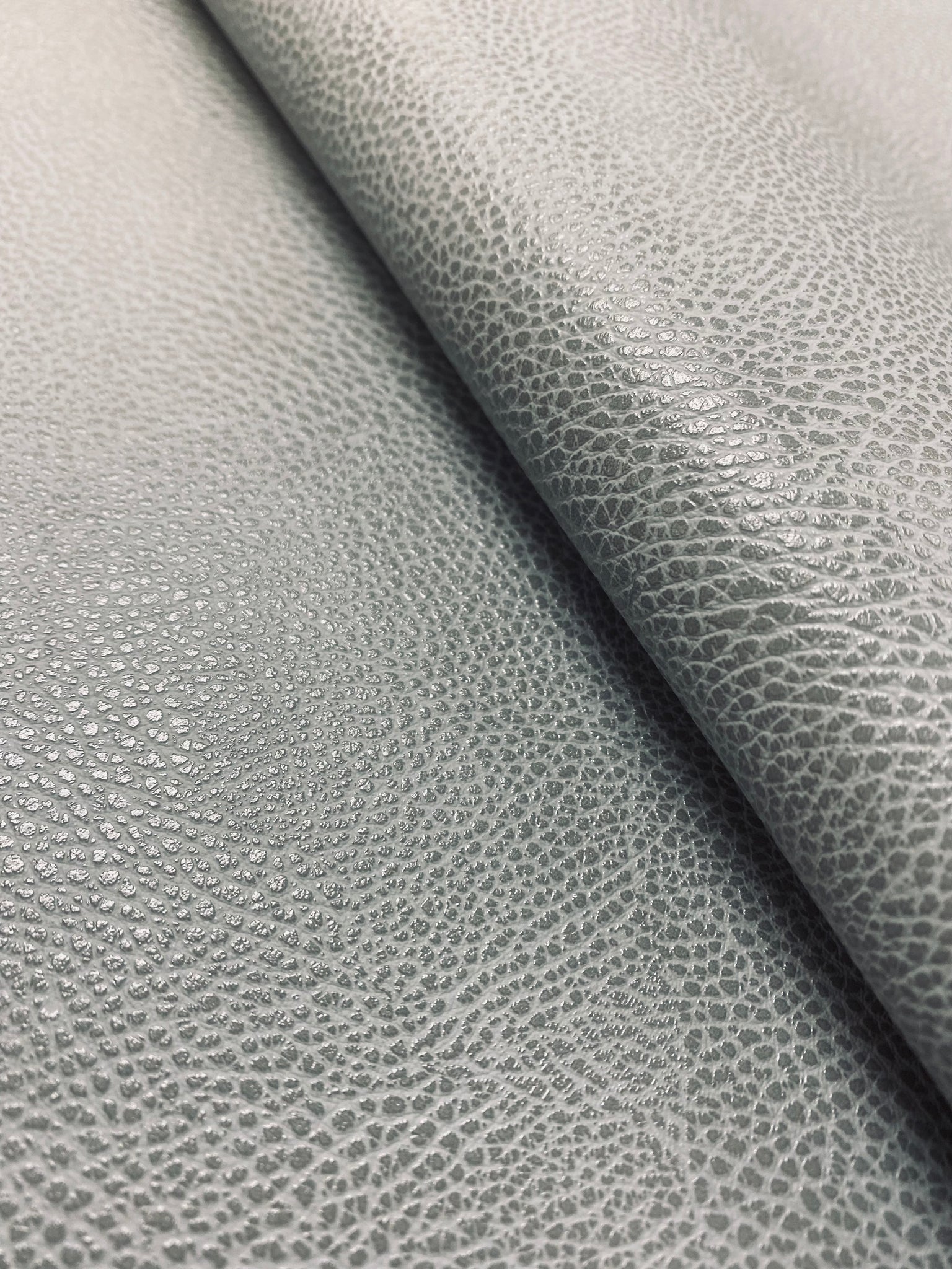 An application scenario or product detail of gray leather fabric - Image 7