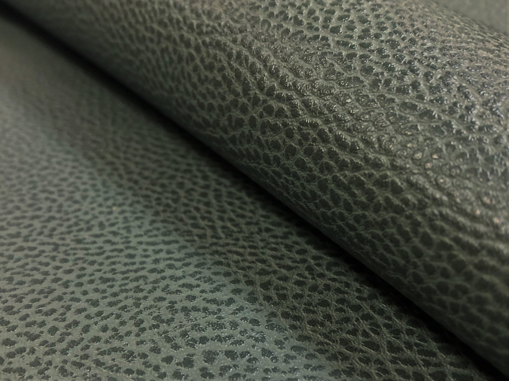 An application scenario or product detail of green leather fabric - Image 19