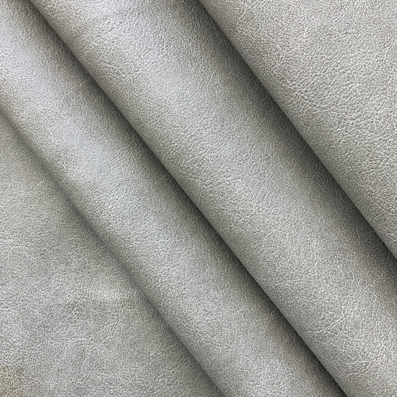 An application scenario or product detail of grey leather fabric - Image 19