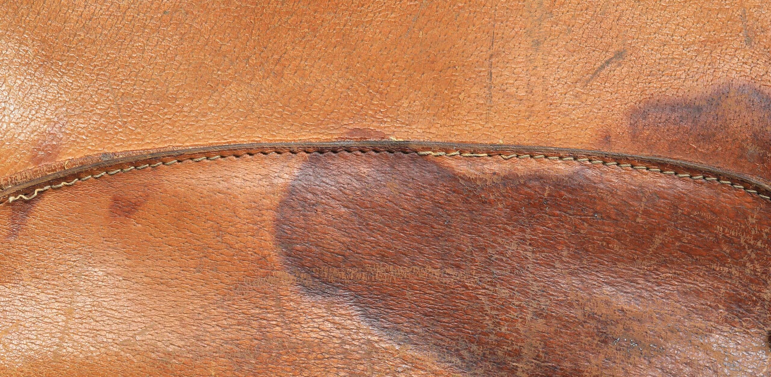 An application scenario or product detail of how to get rid of oil stains on leather - Image 4