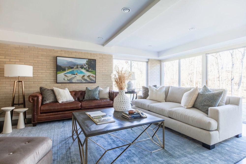 An application scenario or product detail of mixing leather and fabric couches - Image 1