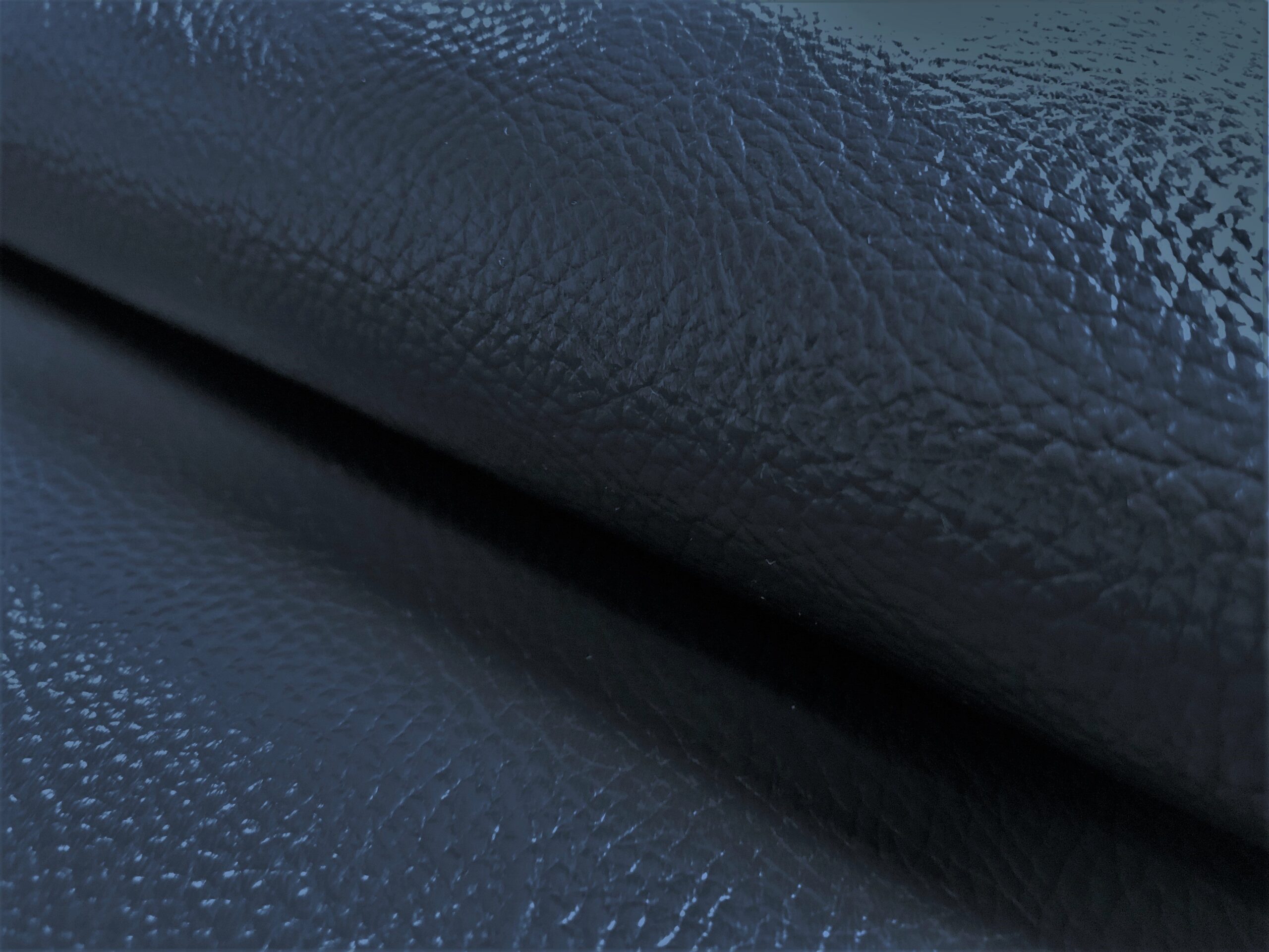 An application scenario or product detail of navy blue faux leather fabric - Image 3