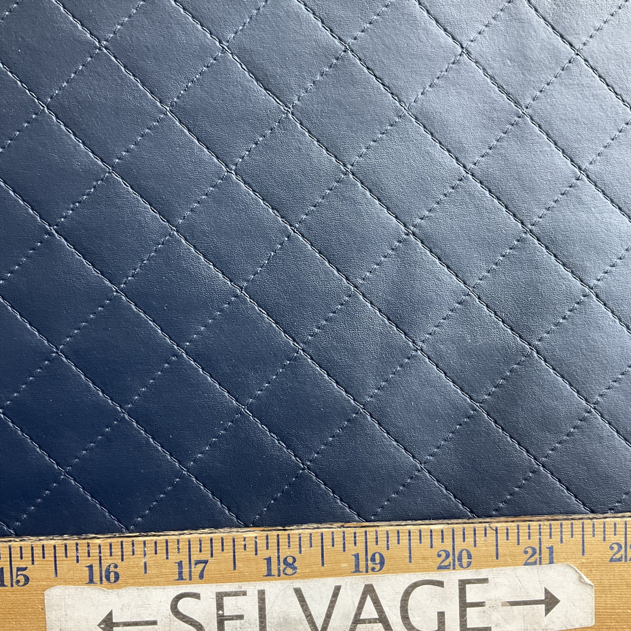 An application scenario or product detail of navy blue faux leather fabric - Image 22