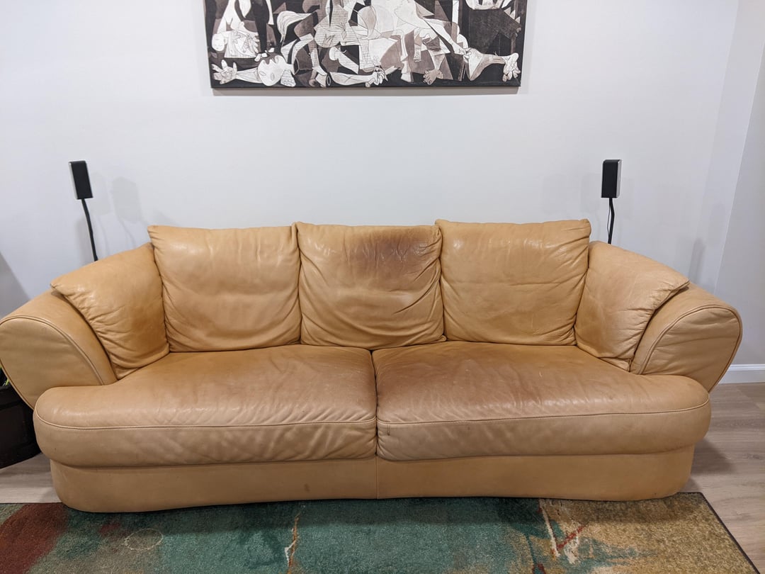 An application scenario or product detail of oil stain on leather sofa - Image 9