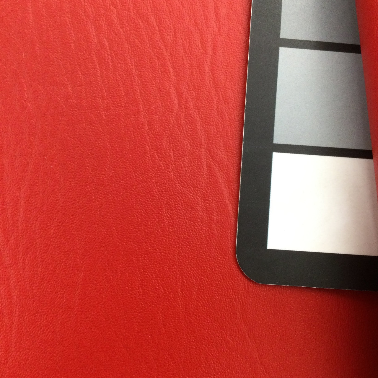 An application scenario or product detail of red fake leather fabric - Image 9