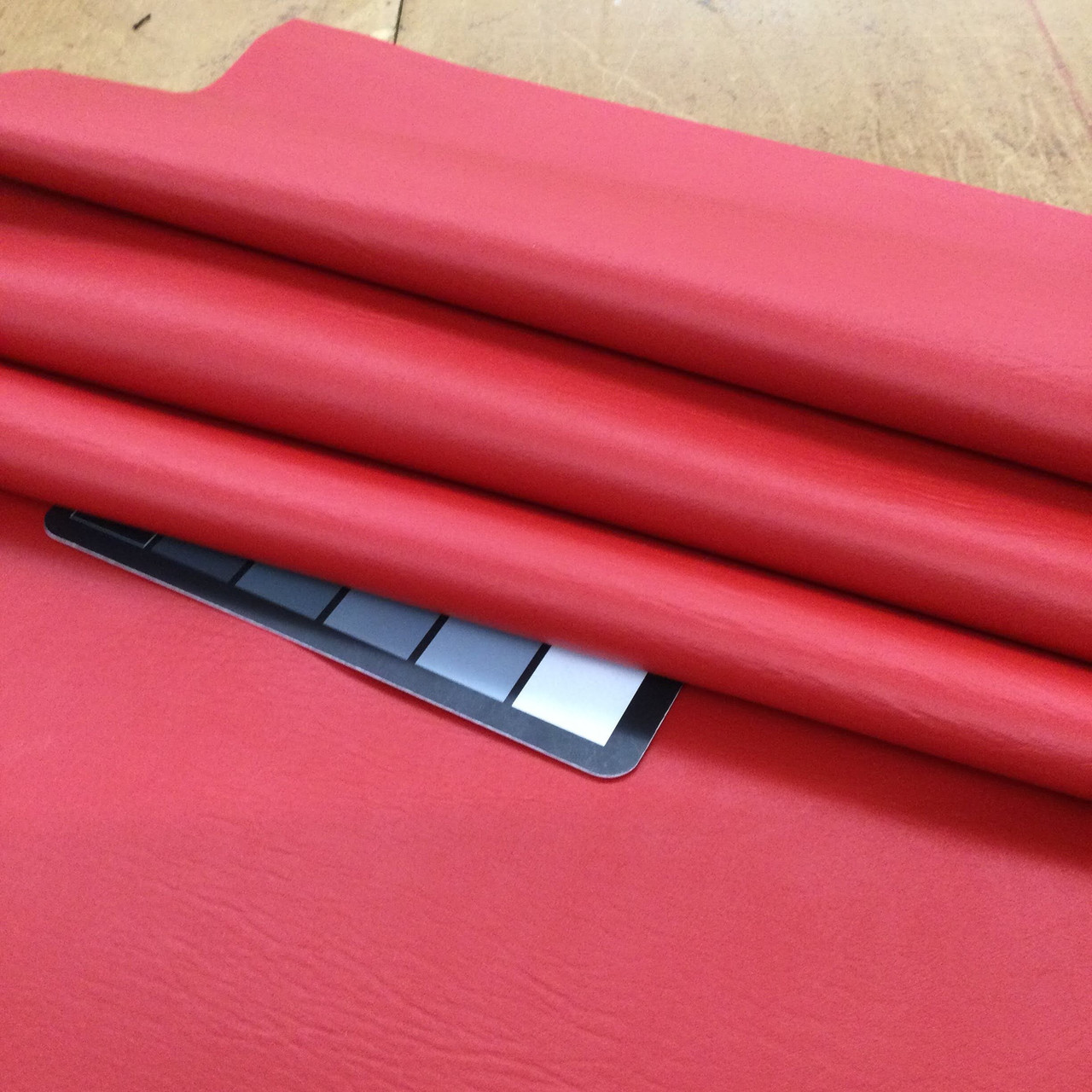 An application scenario or product detail of red faux leather fabric - Image 16