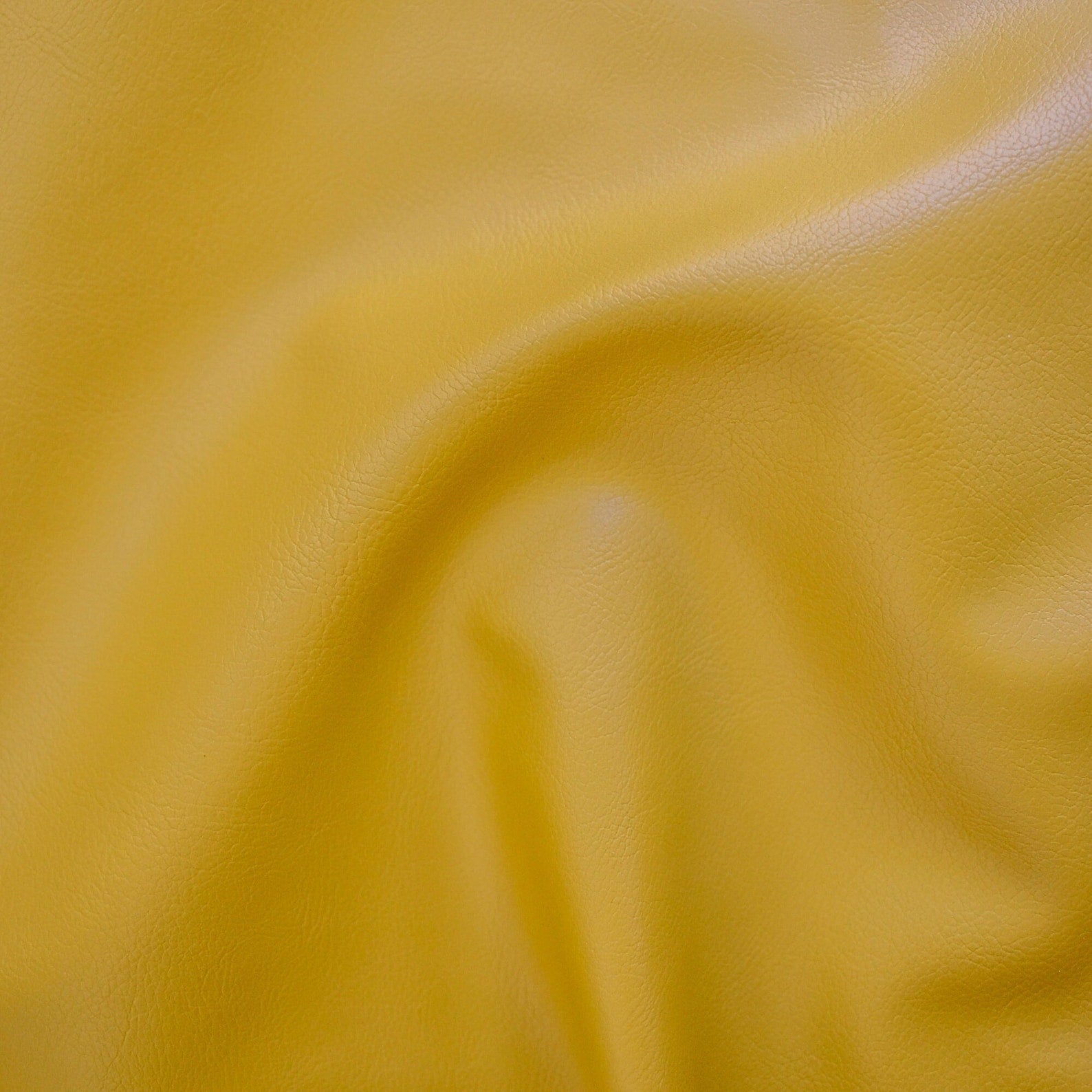 An application scenario or product detail of yellow faux leather fabric - Image 2