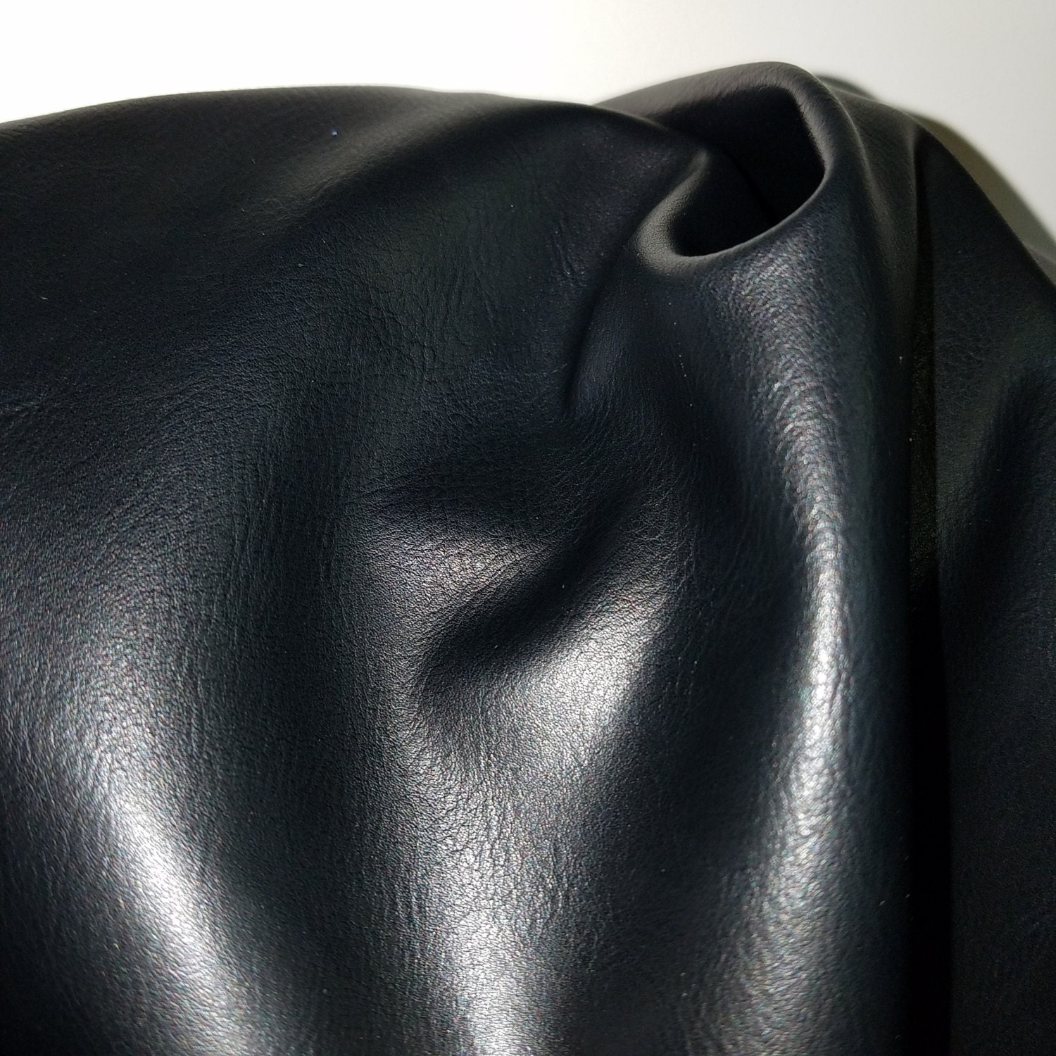 An application scenario or product detail of black faux leather fabric - Image 12