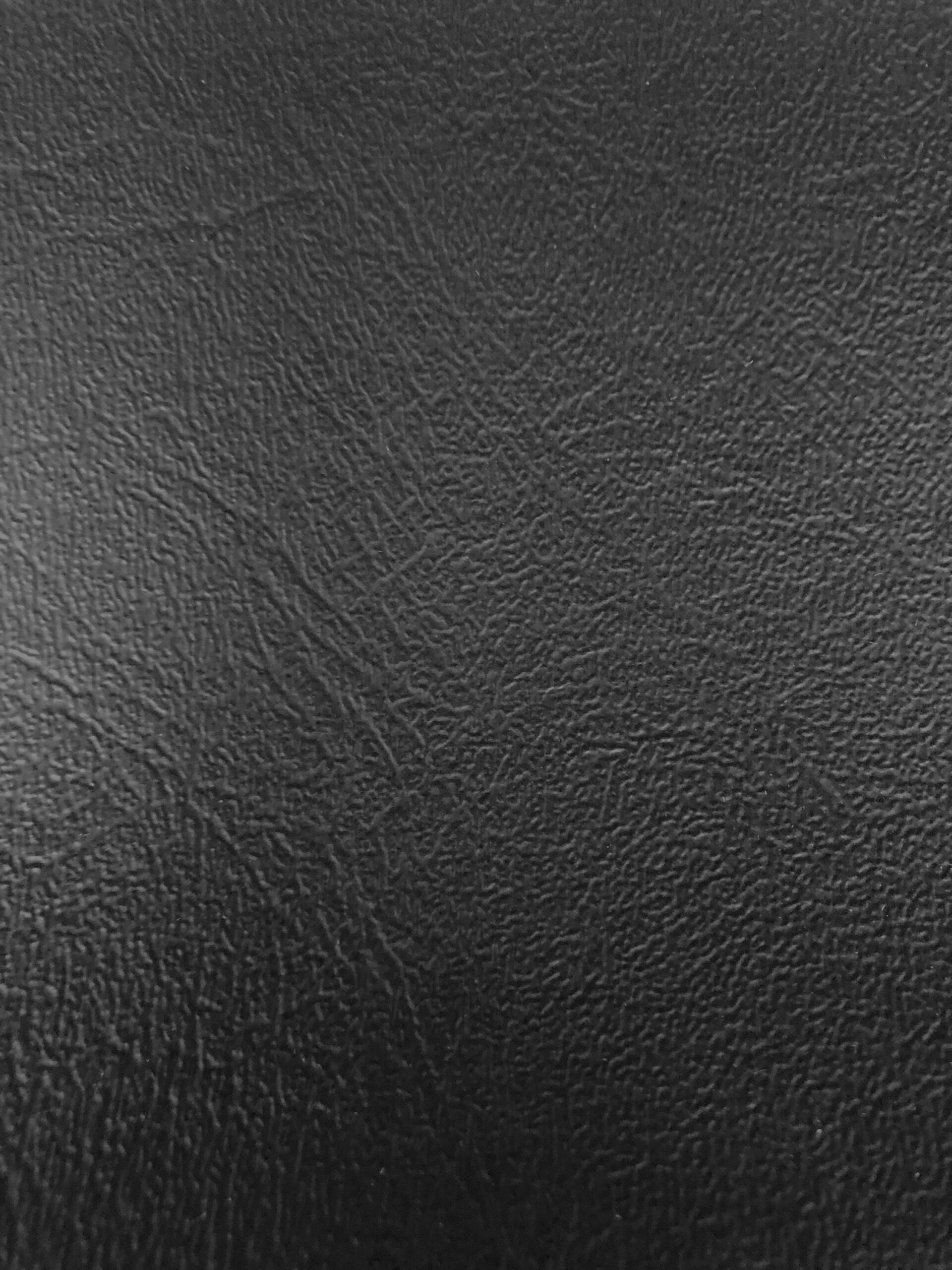 An application scenario or product detail of black faux leather upholstery fabric - Image 6
