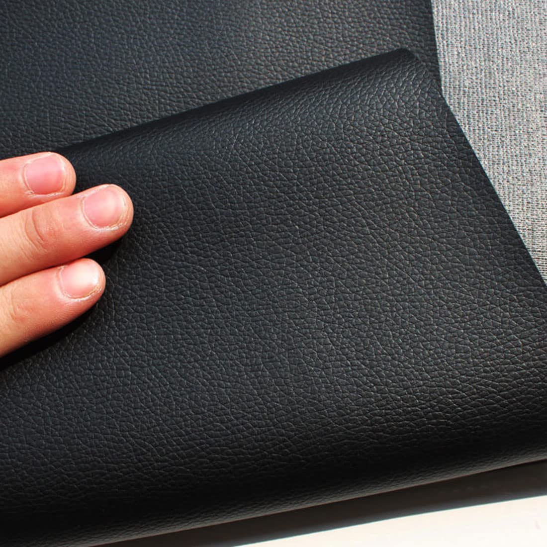 An application scenario or product detail of black faux leather upholstery fabric - Image 16