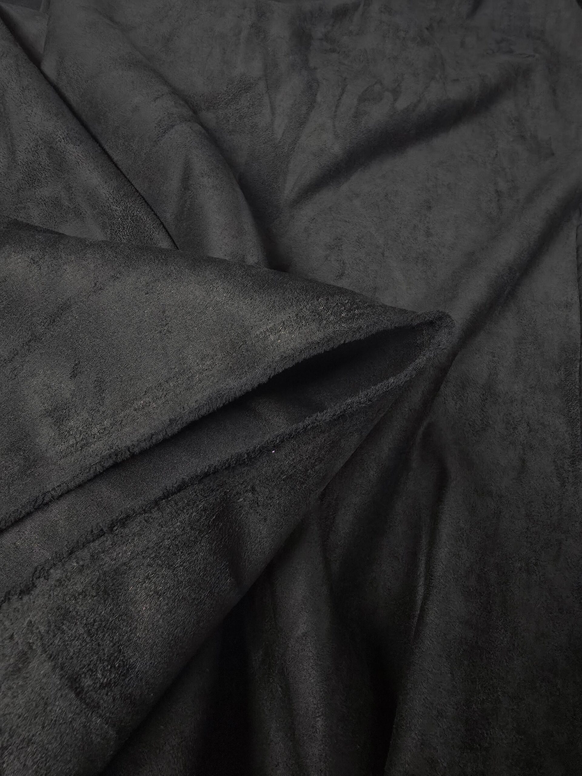 An application scenario or product detail of black faux suede material - Image 11