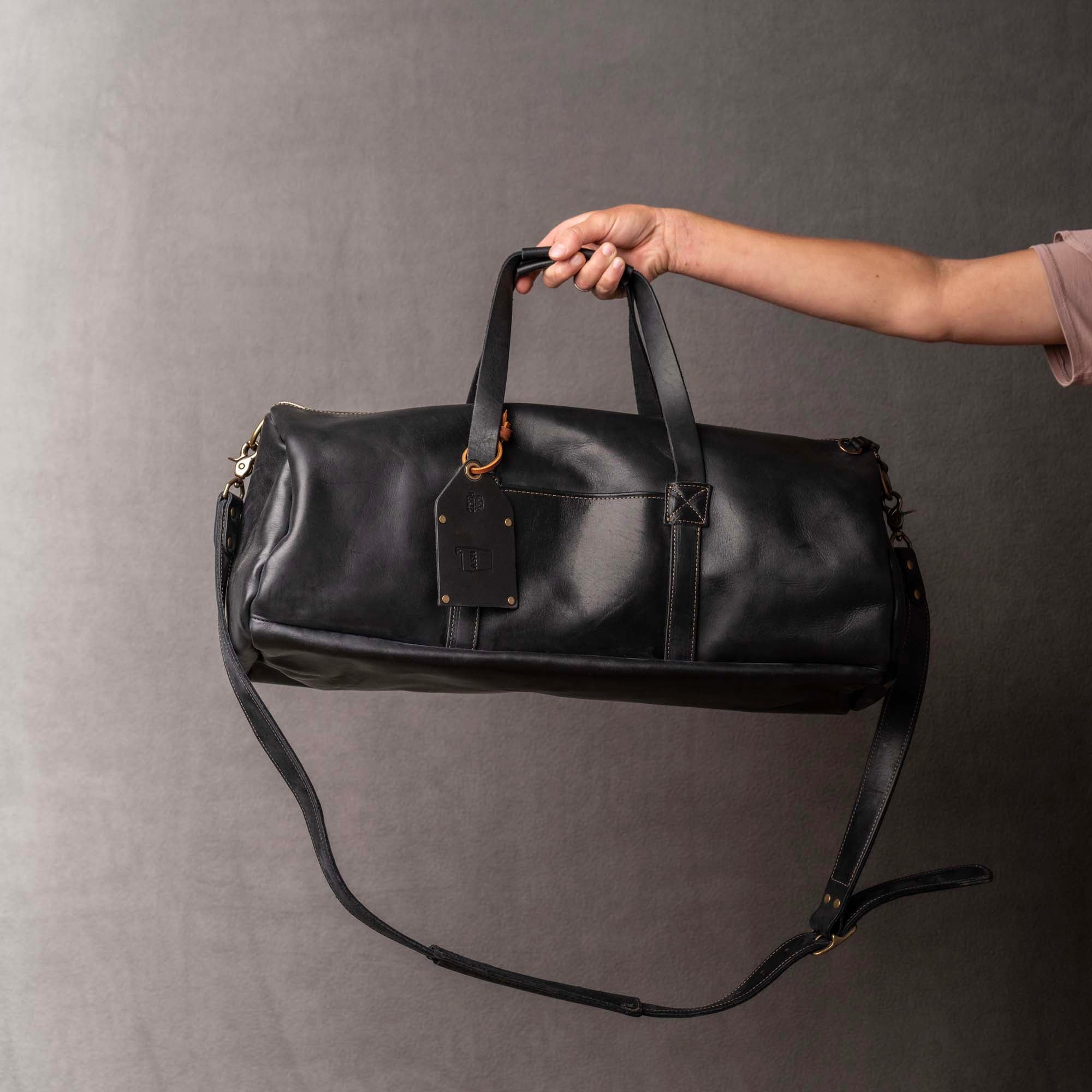 An application scenario or product detail of custom leather bags with logo - Image 12