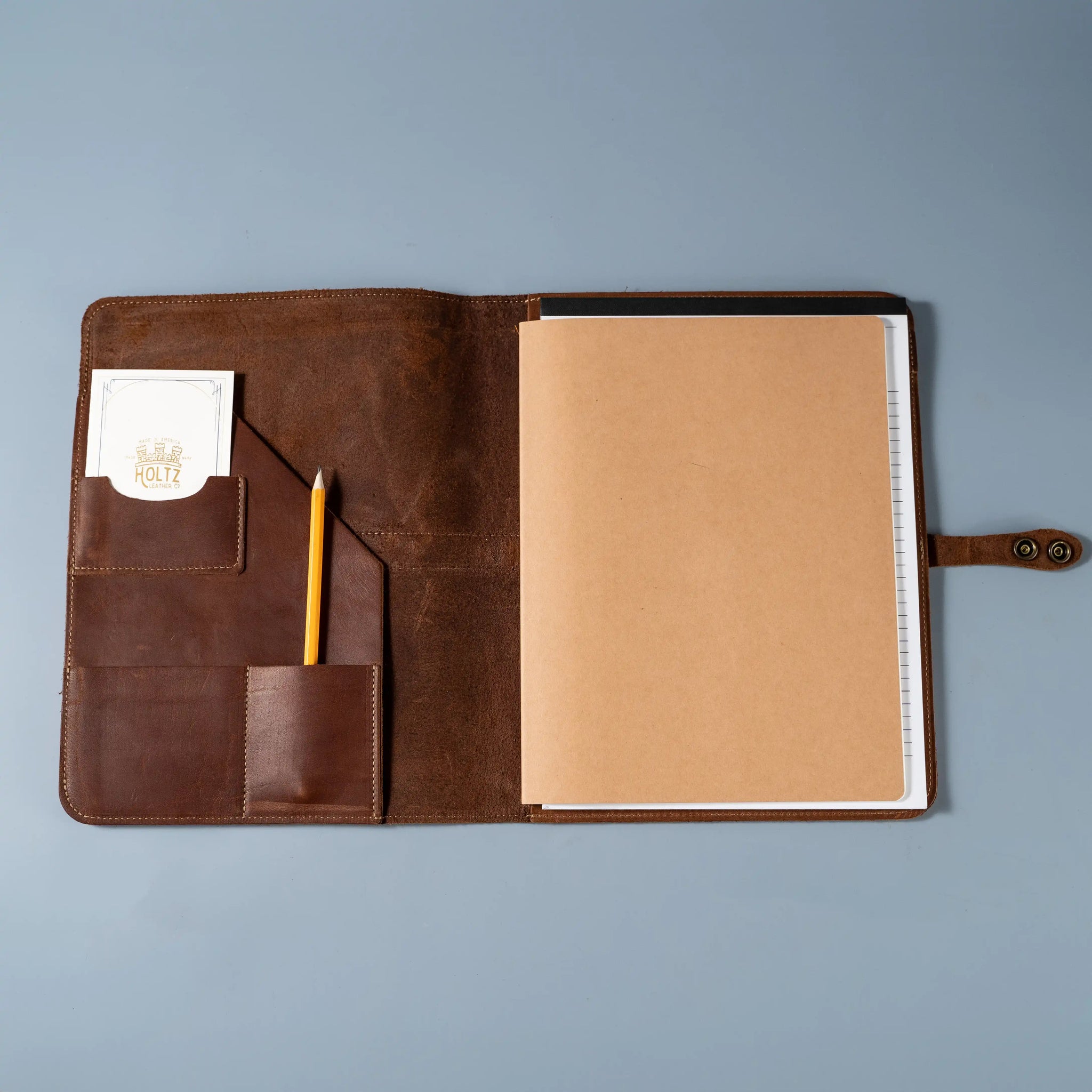 An application scenario or product detail of custom leather portfolio with logo - Image 1
