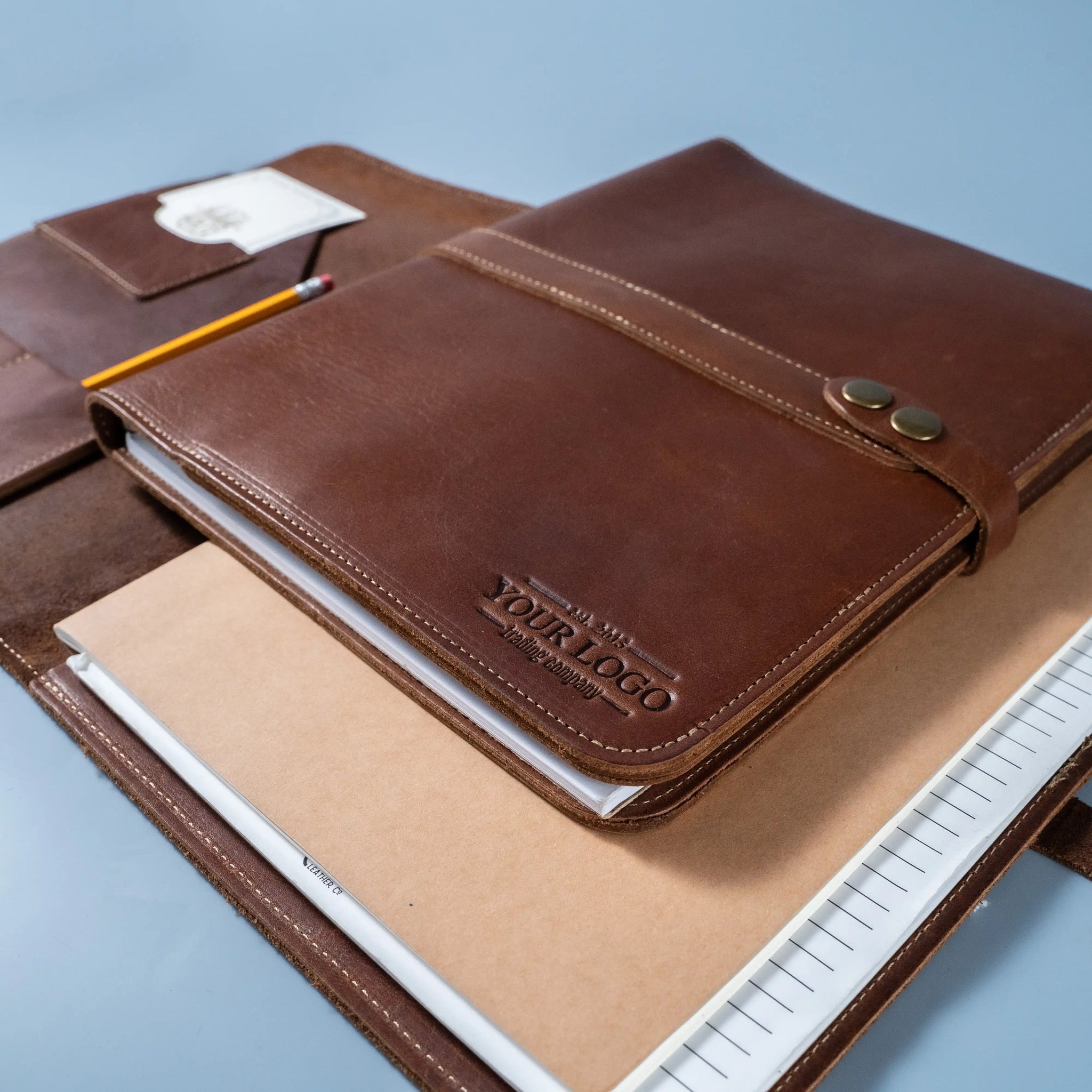 An application scenario or product detail of custom leather portfolio with logo - Image 9