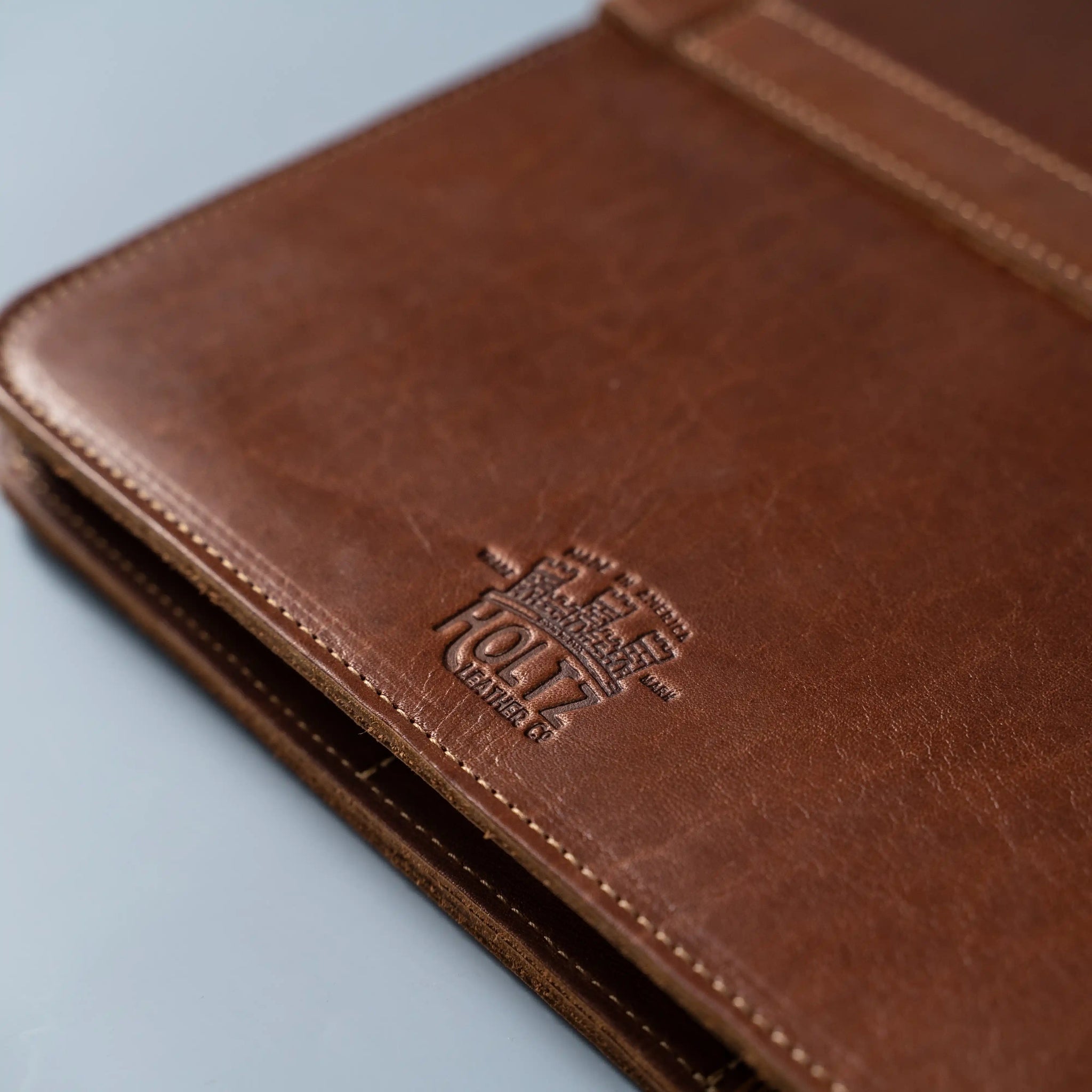 An application scenario or product detail of custom leather portfolio with logo - Image 17