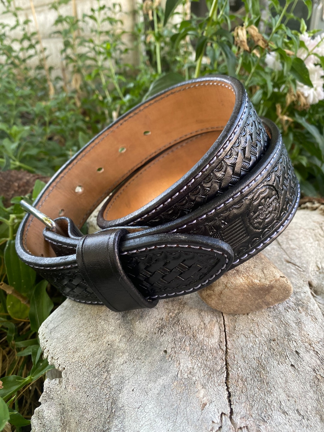 An application scenario or product detail of custom tooled leather belts - Image 1