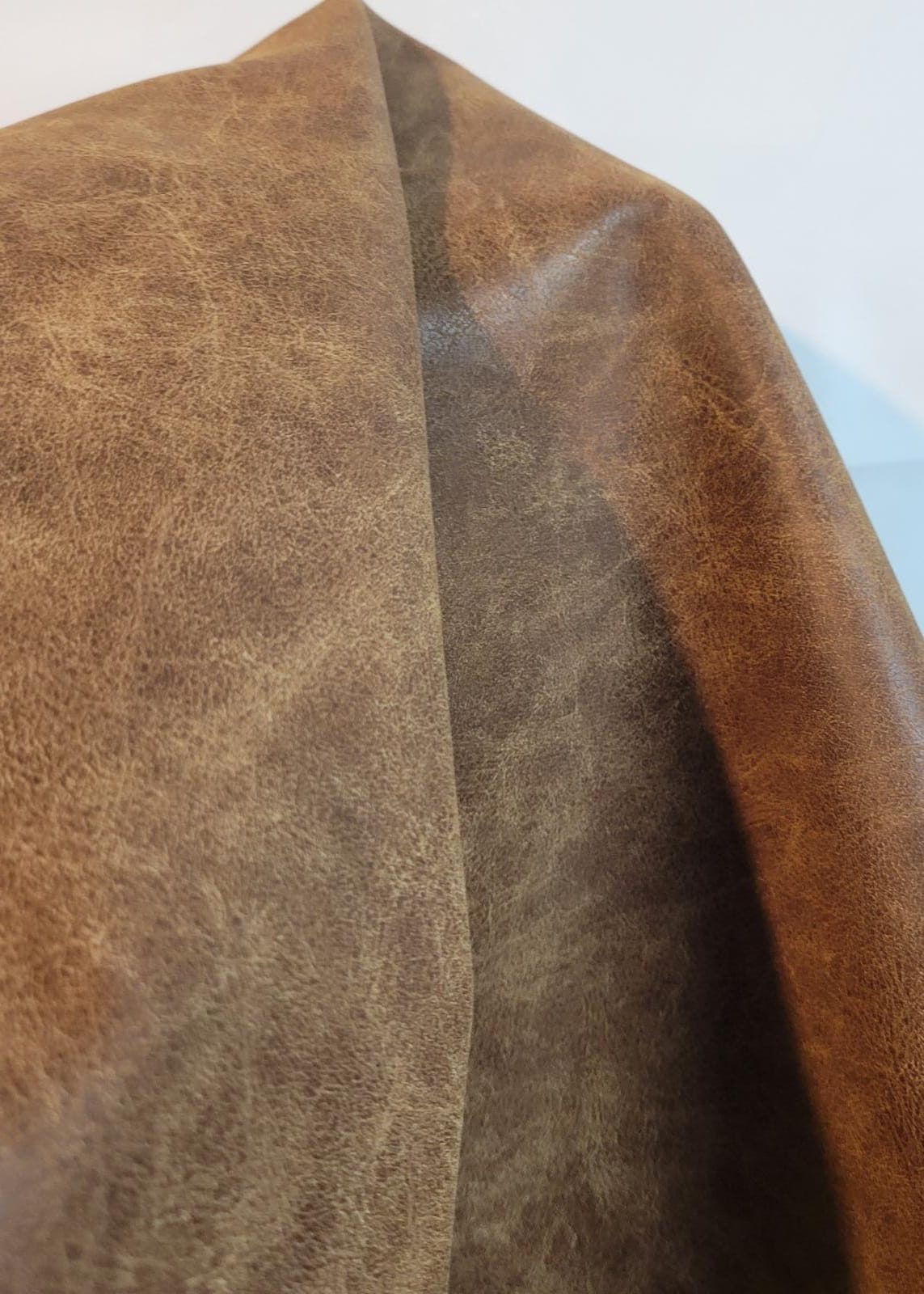 An application scenario or product detail of distressed faux leather - Image 12