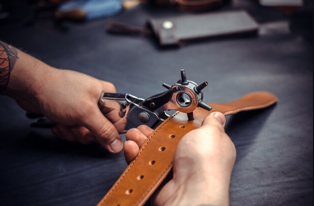 An application scenario or product detail of how to make a hole in a leather belt - Image 2