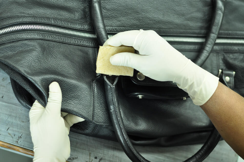 An application scenario or product detail of leather handbag cleaning service - Image 1
