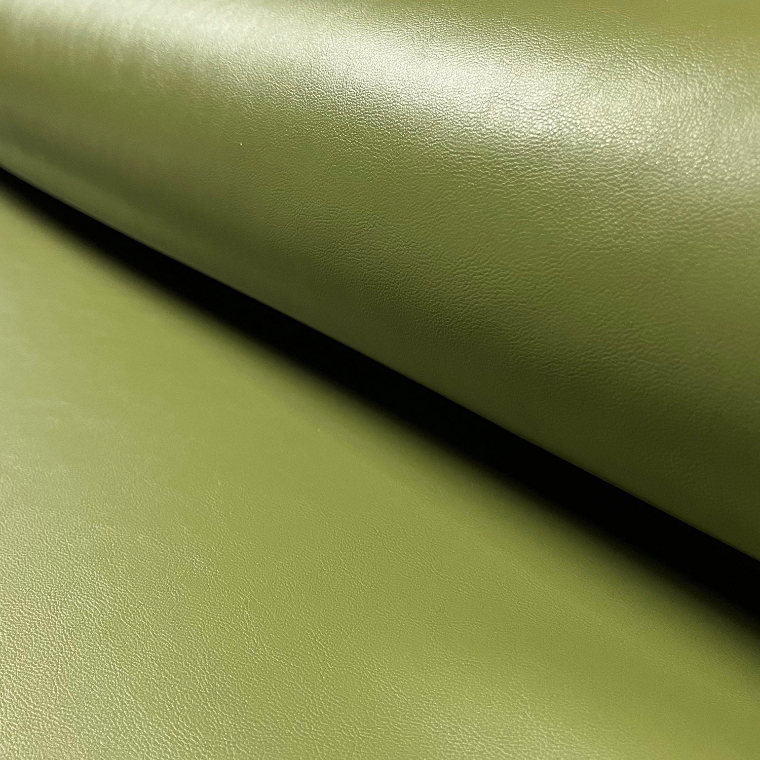 An application scenario or product detail of olive green leather fabric - Image 6