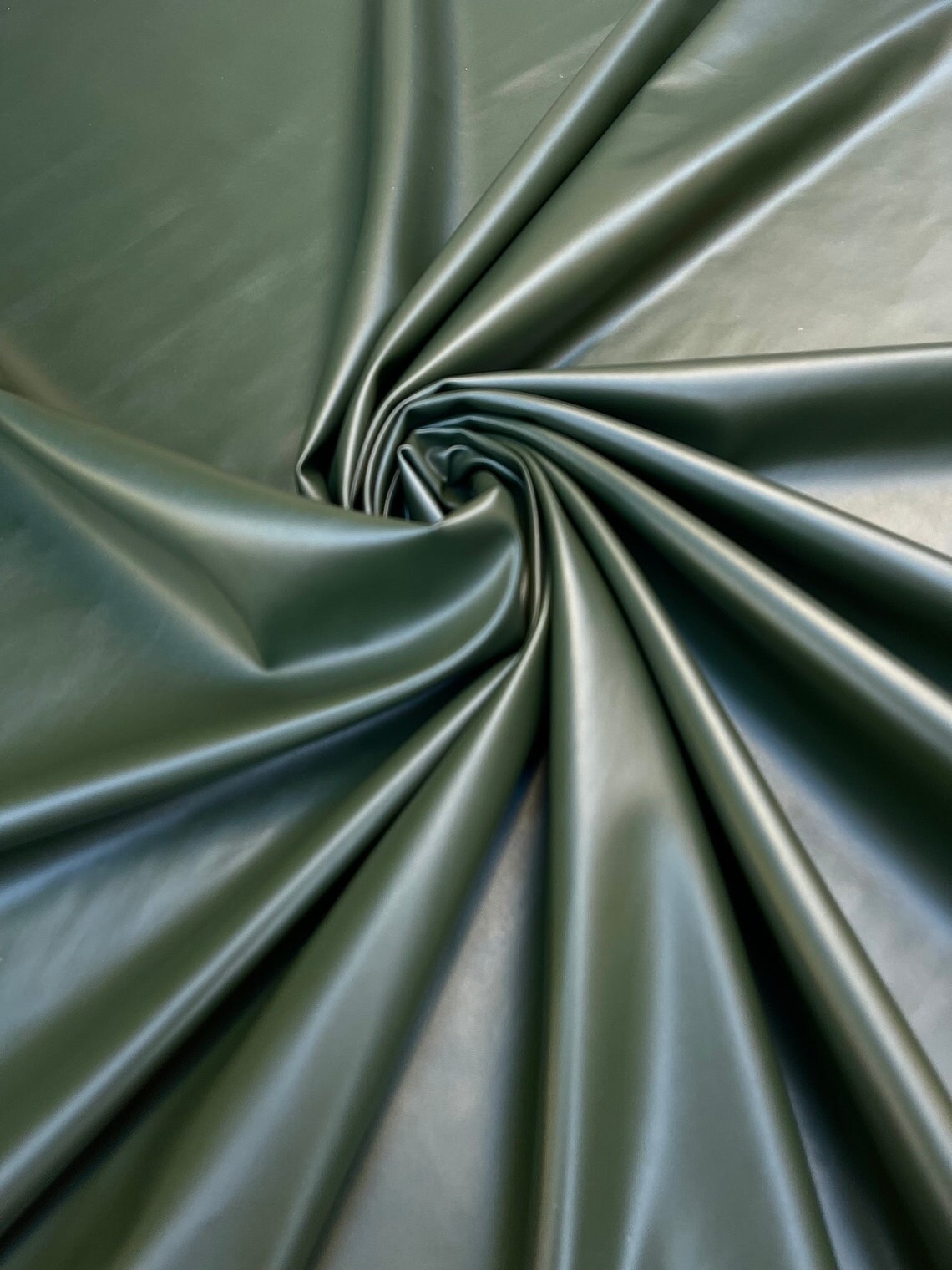 An application scenario or product detail of olive green leather fabric - Image 7