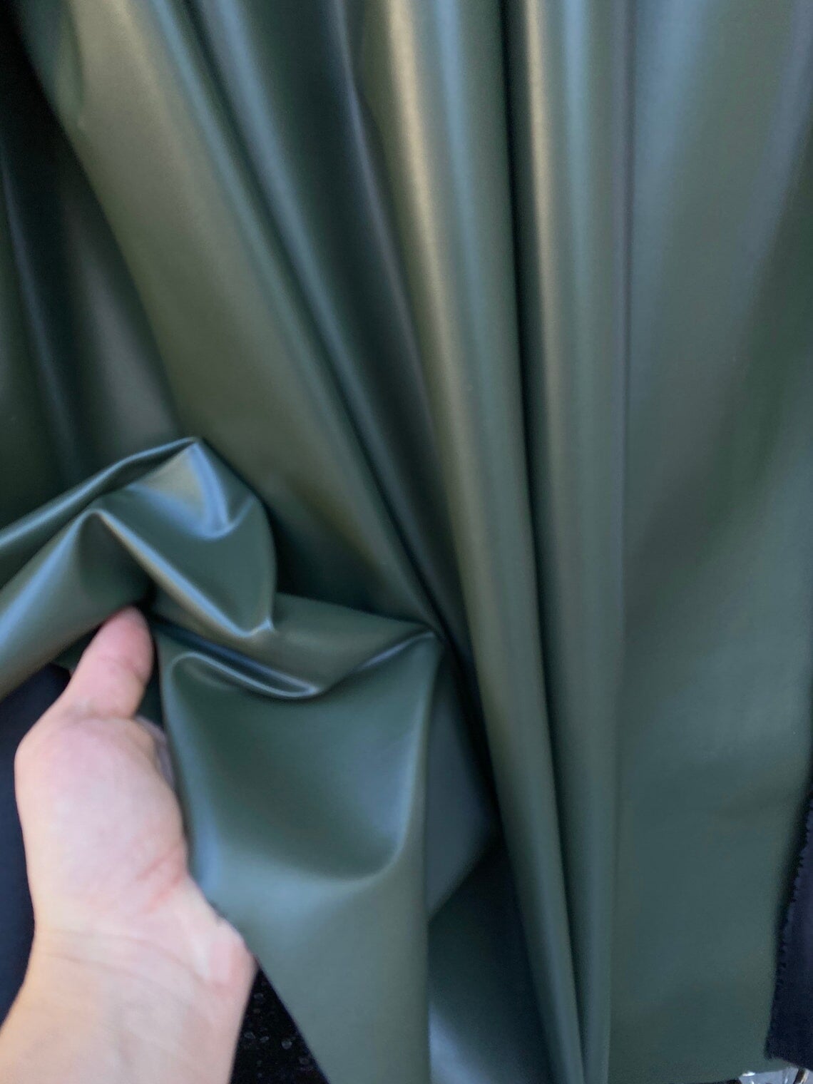 An application scenario or product detail of olive green leather fabric - Image 22