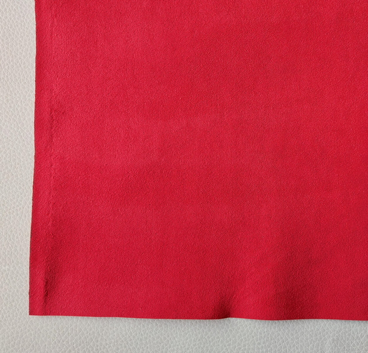 An application scenario or product detail of red alcantara material - Image 5