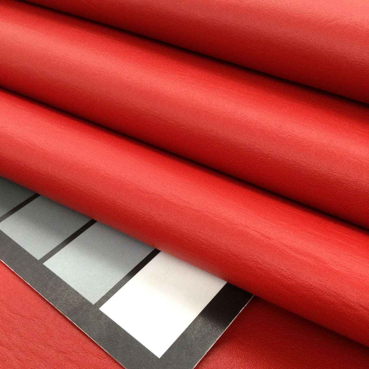 An application scenario or product detail of red fake leather fabric - Image 13