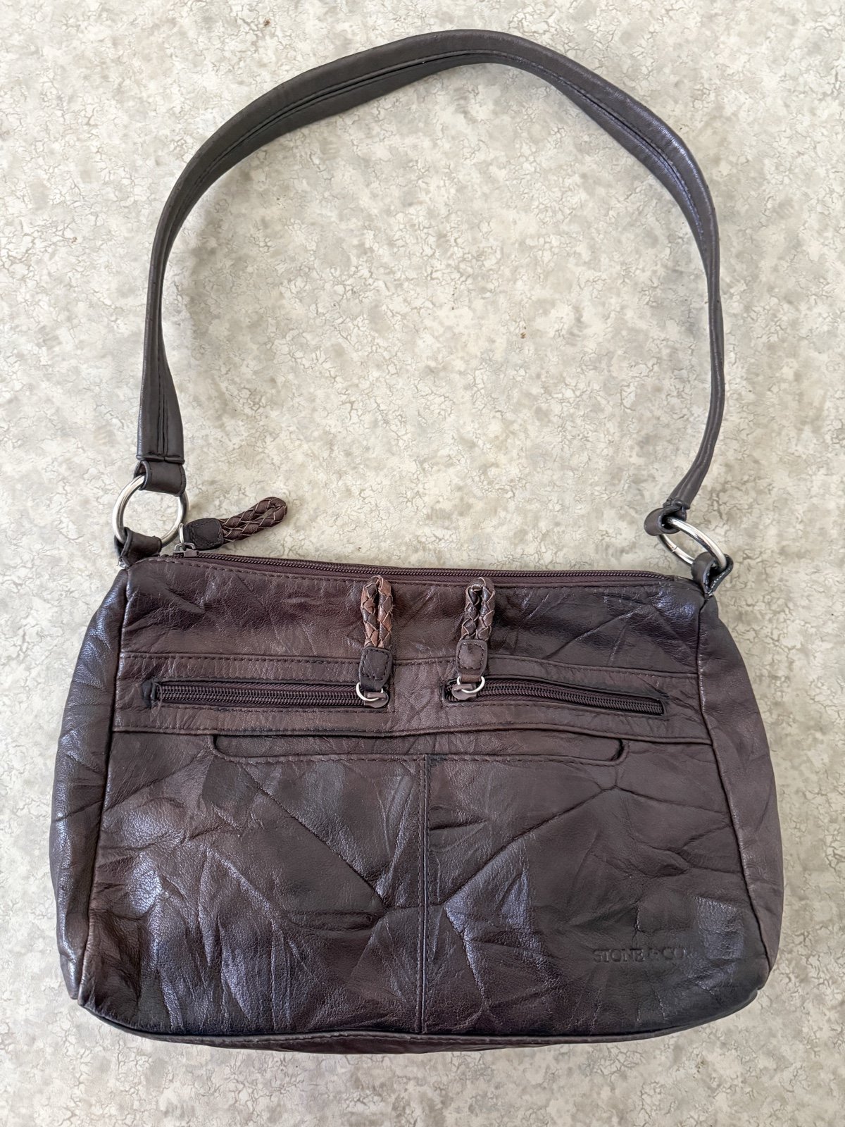 An application scenario or product detail of stone and company leather purses - Image 19