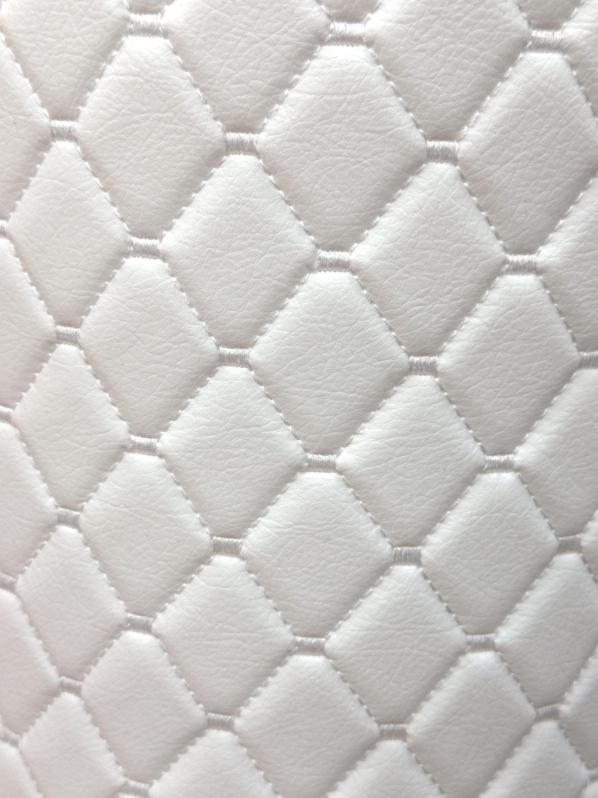 An application scenario or product detail of white fake leather fabric - Image 10