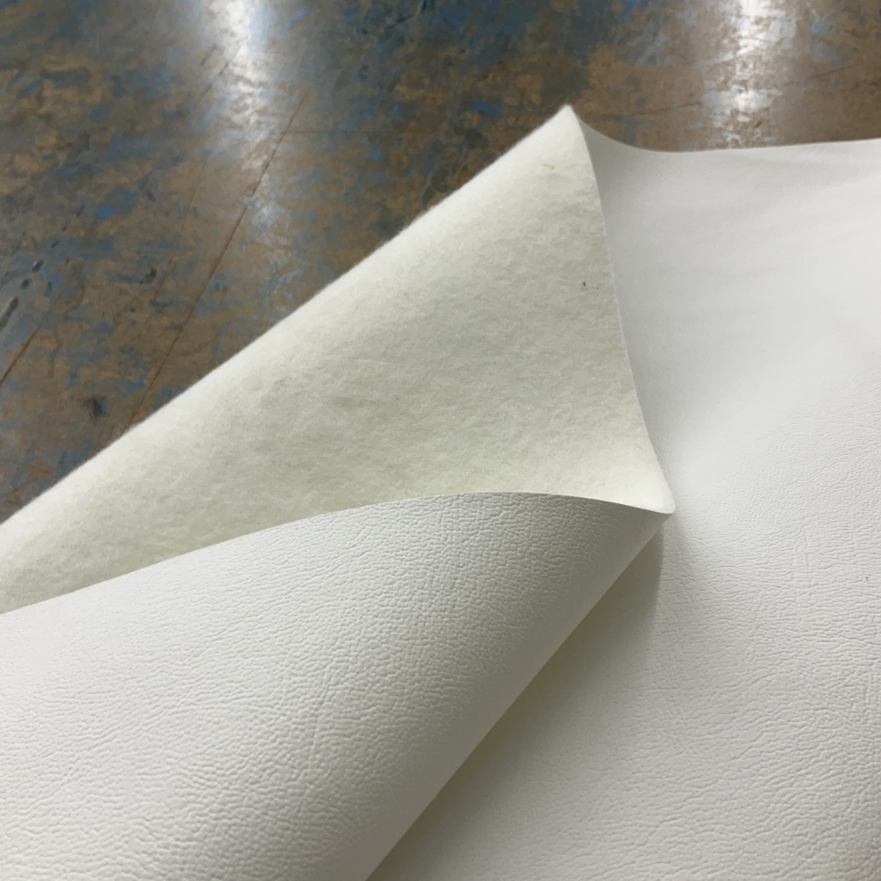 An application scenario or product detail of white fake leather fabric - Image 16