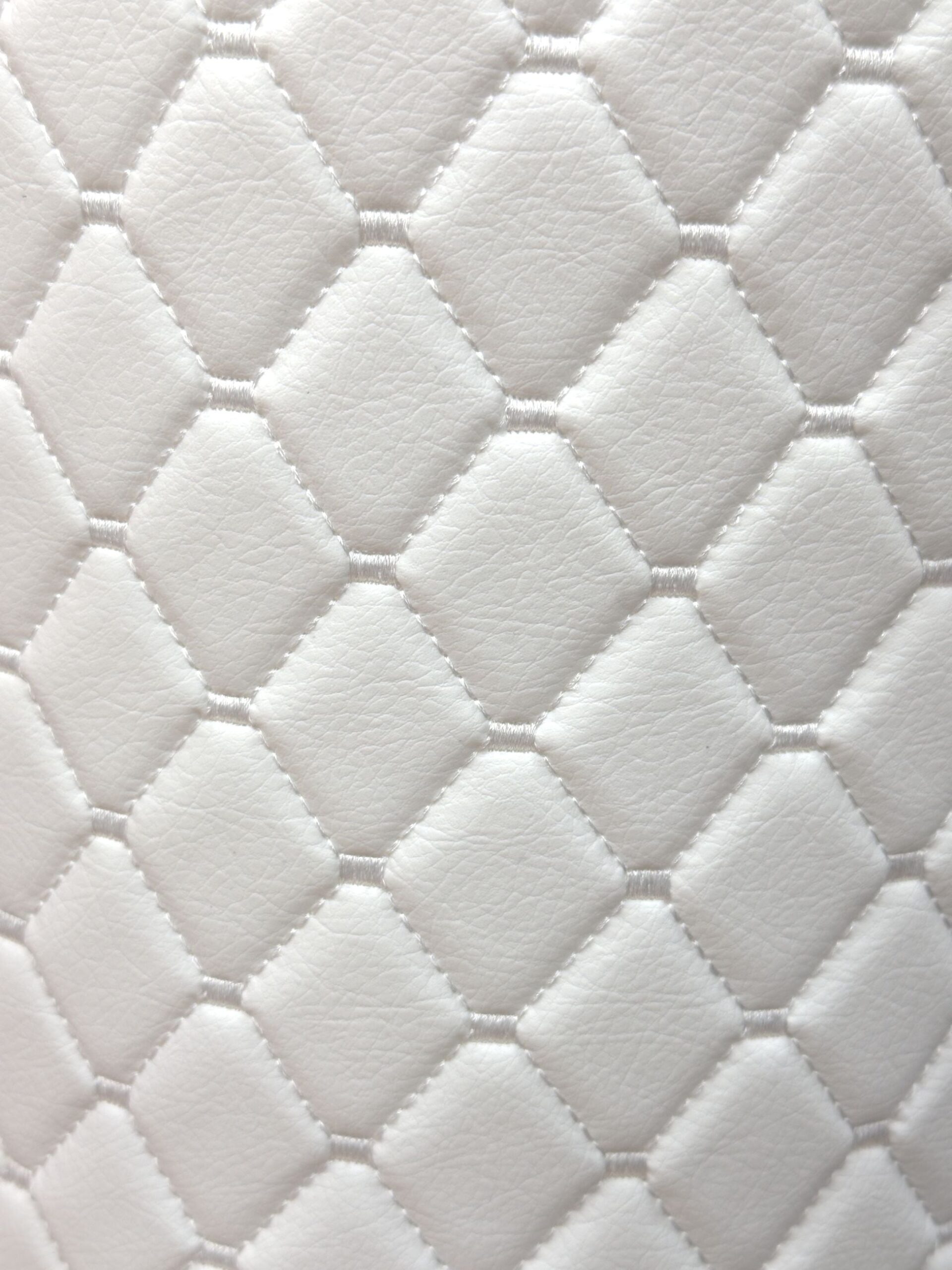 An application scenario or product detail of white faux leather fabric - Image 9